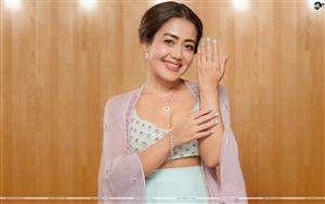 Neha Kakkar shows off her ring in a traditional wear